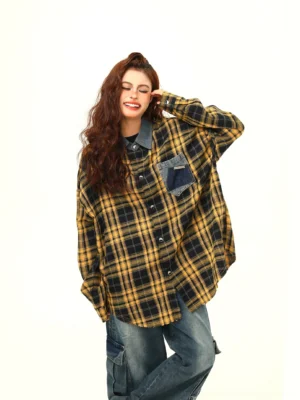 Yellow black plaid oversized shirt jacket with denim patch pocket and dropped shoulders three quarter streetwear view