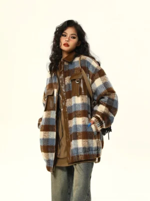 Oversized brown blue beige plaid wool blend shacket with faux leather pocket trim styled with wide leg jeans and a shoulder bag
