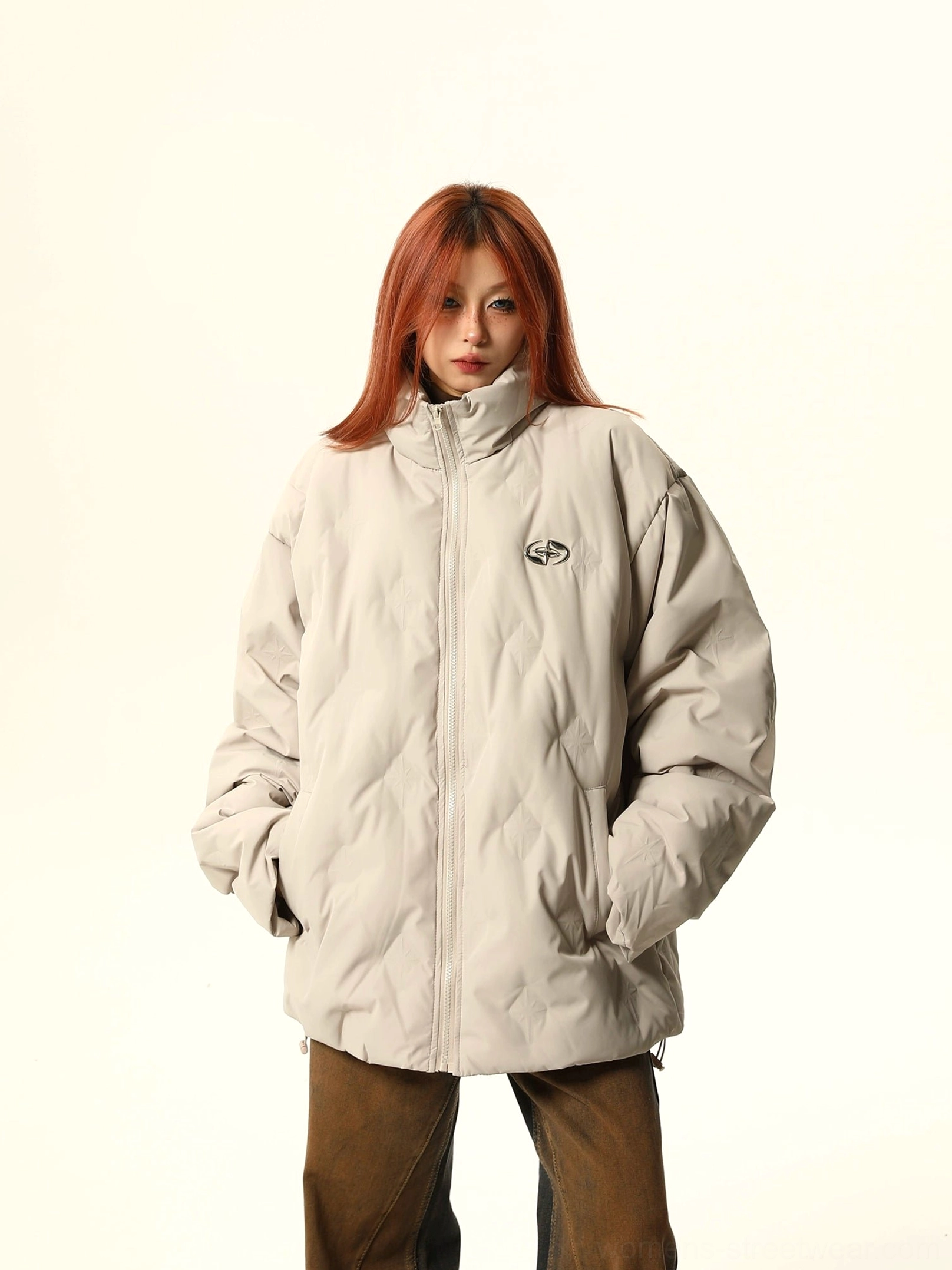 Oversized quilted bomber jacket with stand collar and minimalist streetwear silhouette in a modern neutral color