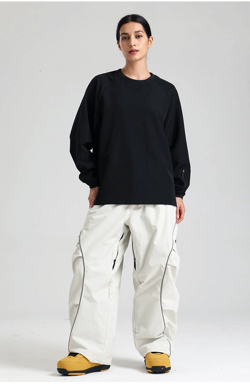 Oversized reflective piped snowboard cargo pants made for snow park riding and streetwear styling
