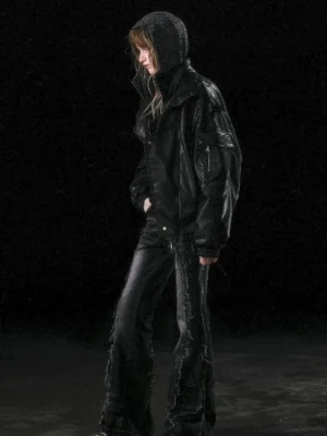 Black oversized faux leather biker jacket side rear view showing concealed hood detail and sleeve zipper pocket