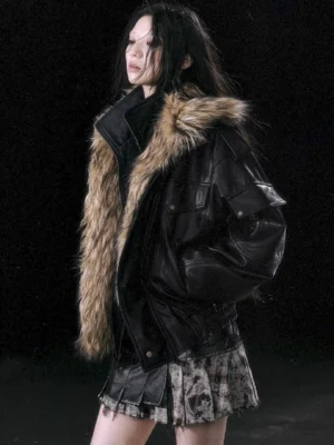 Oversized removable faux fur collar faux leather biker jacket in black, three-quarter front view styled with a tie-dye mini skirt