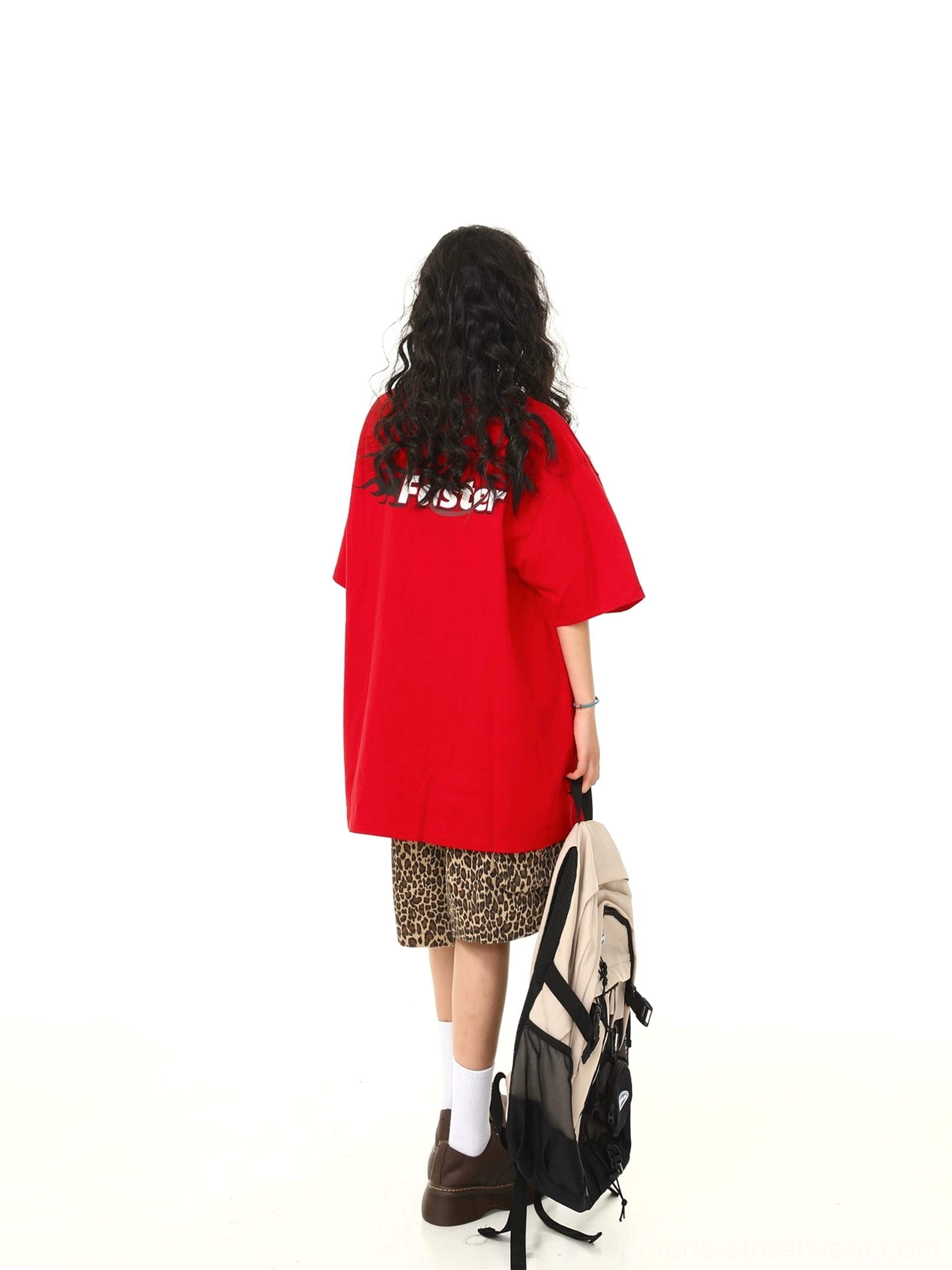 Back view of red oversized retro speed graphic streetwear t-shirt with small back lettering detail