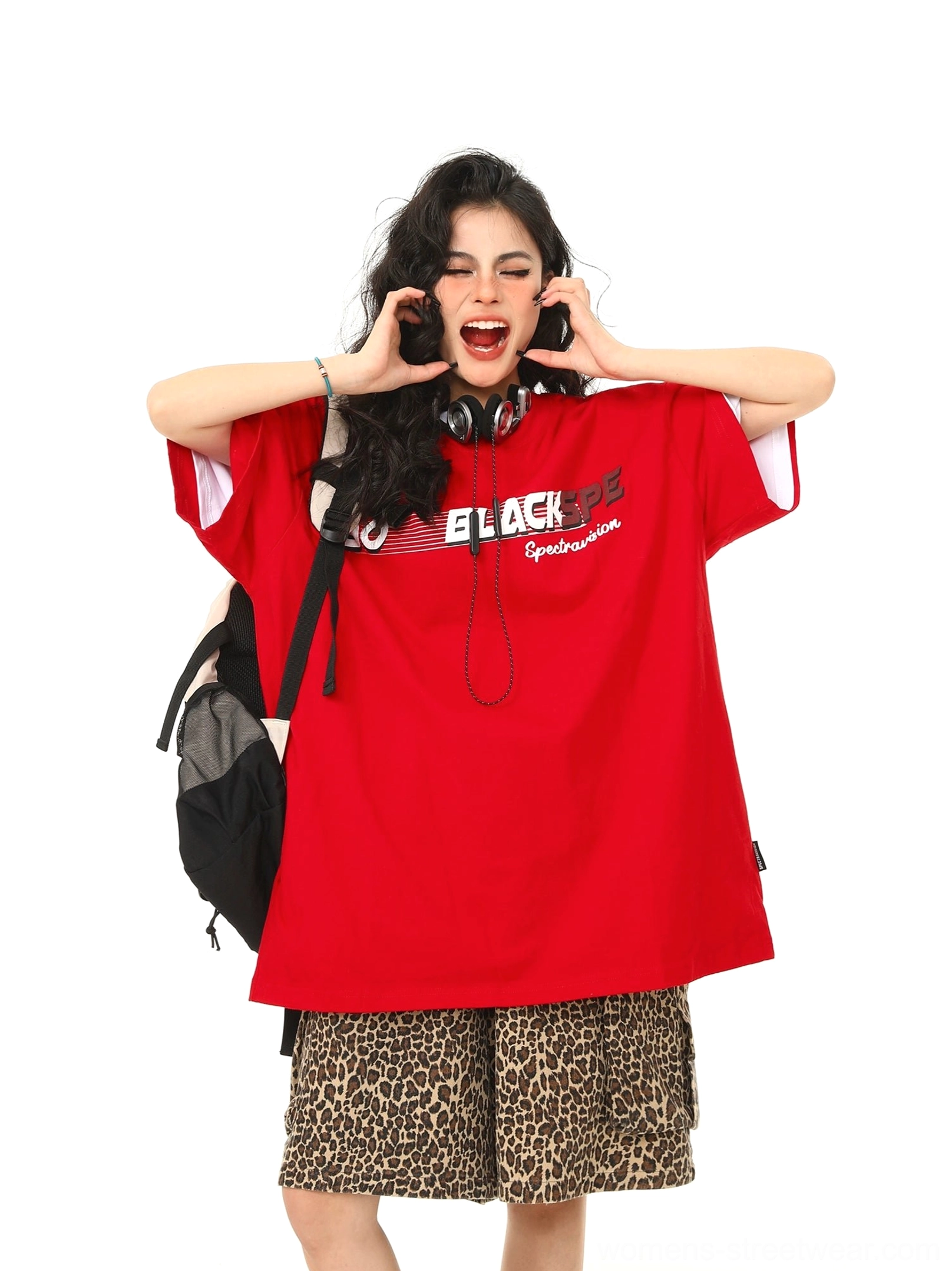 Red oversized retro speed graphic tee showing wide short sleeves and black chest print