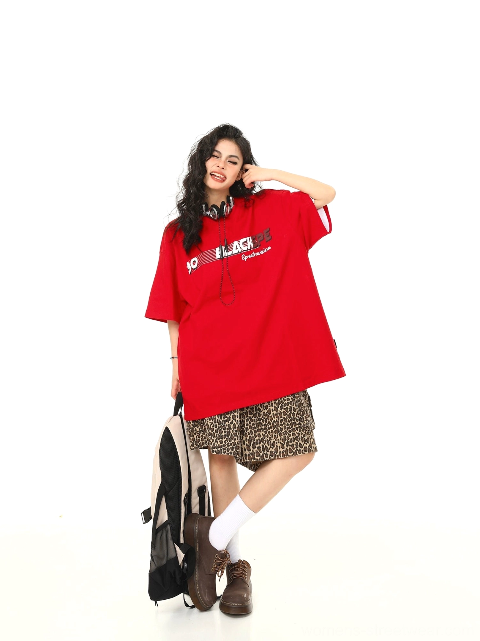 Red oversized speed graphic t-shirt paired with leopard print bottoms and brown loafers