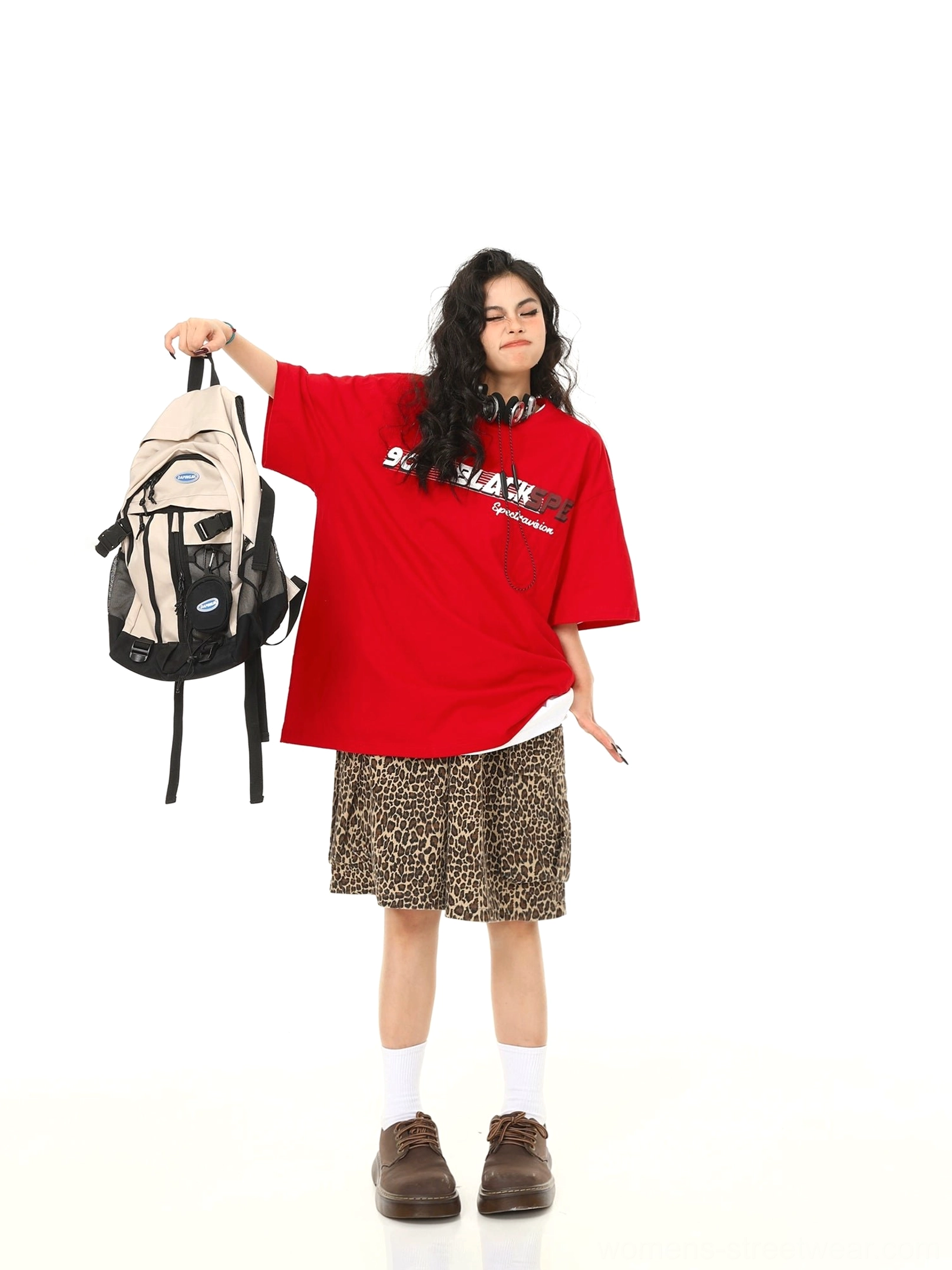 Red retro speed graphic oversized t-shirt front three-quarter view in playful Seoul streetwear styling