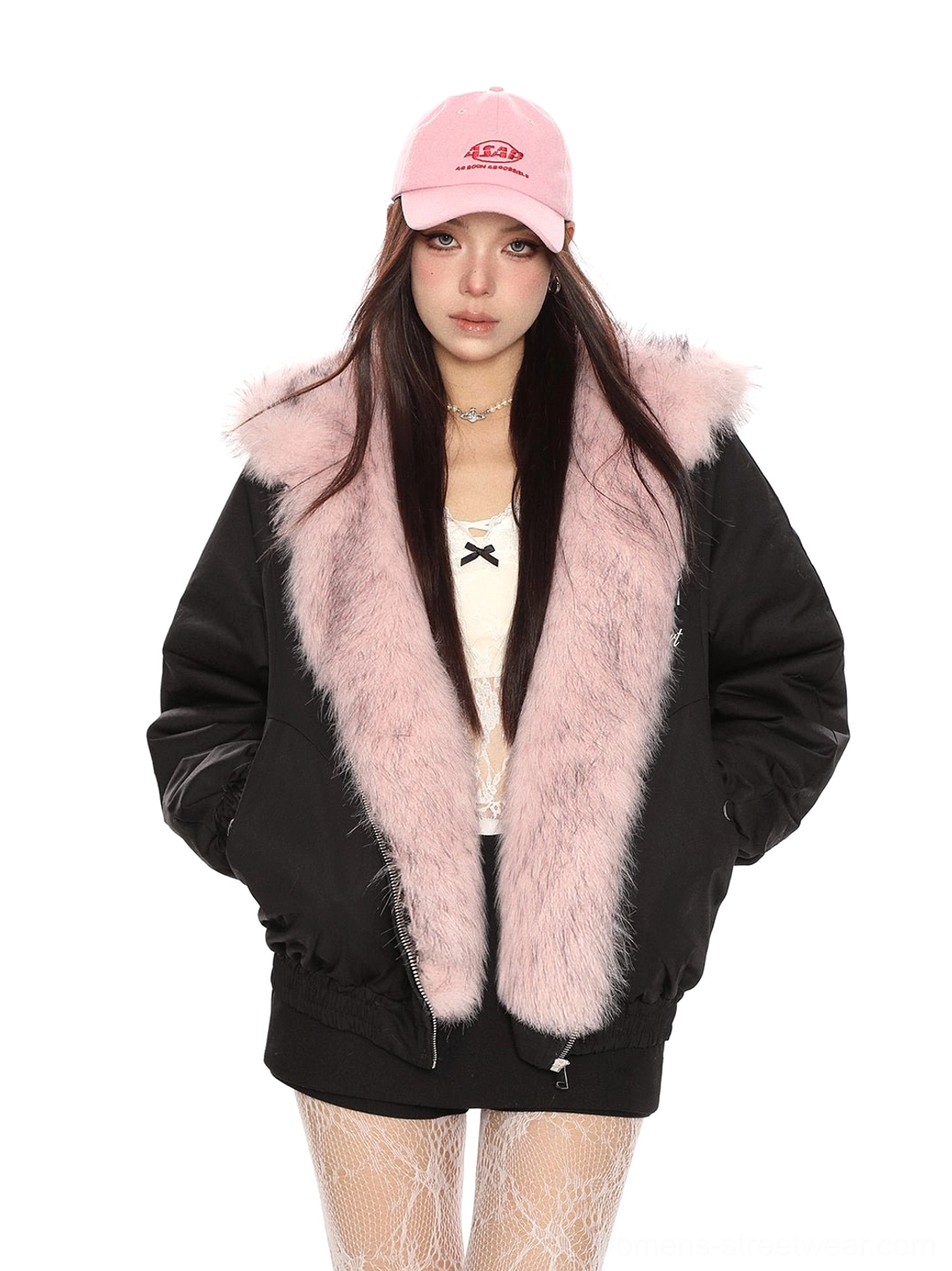 Black reversible puffer jacket with pink faux fur hood trim and adjustable drawstring hem
