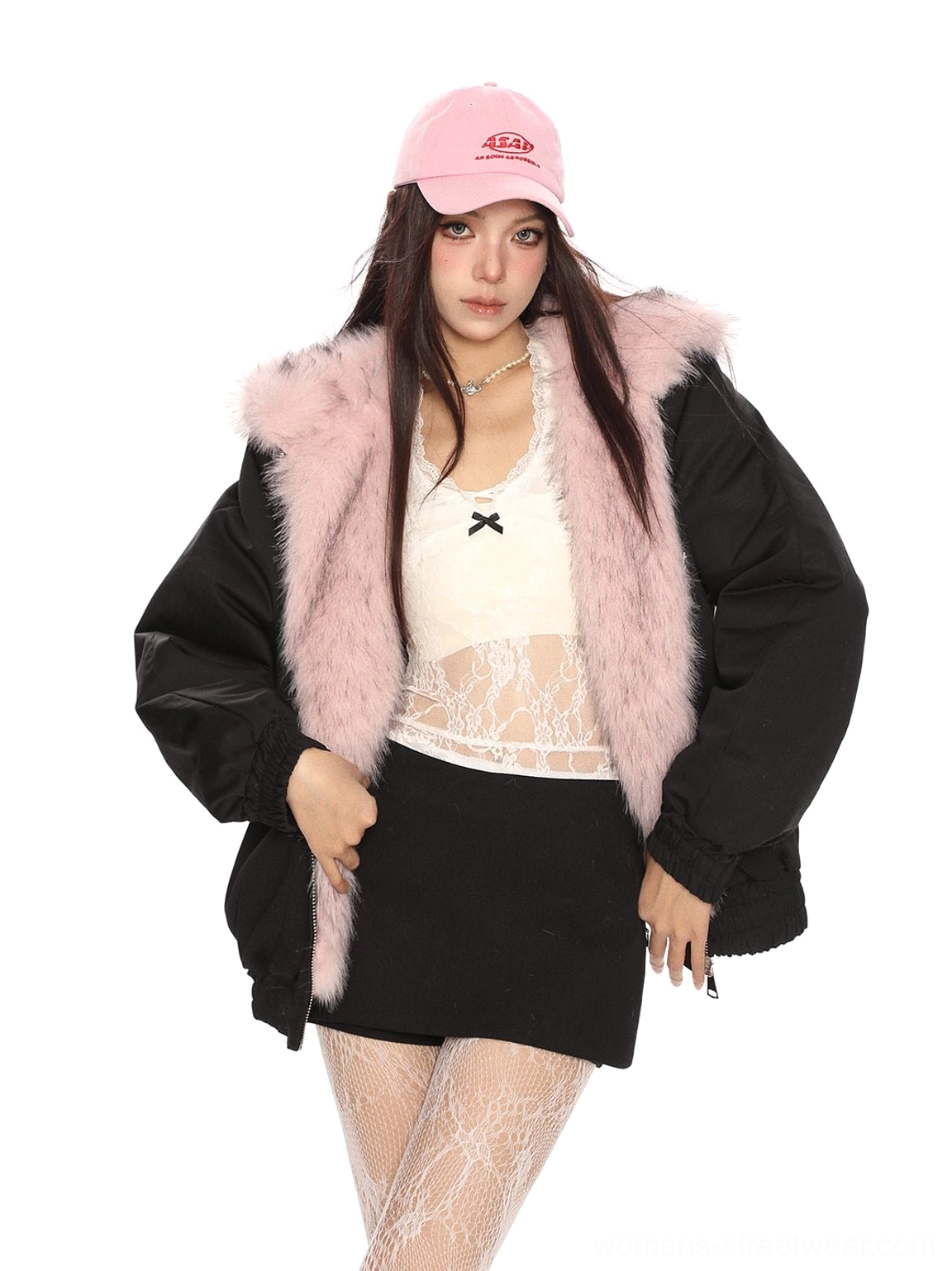 Black oversized reversible faux fur hooded puffer jacket worn open with a Y2K mini skirt outfit