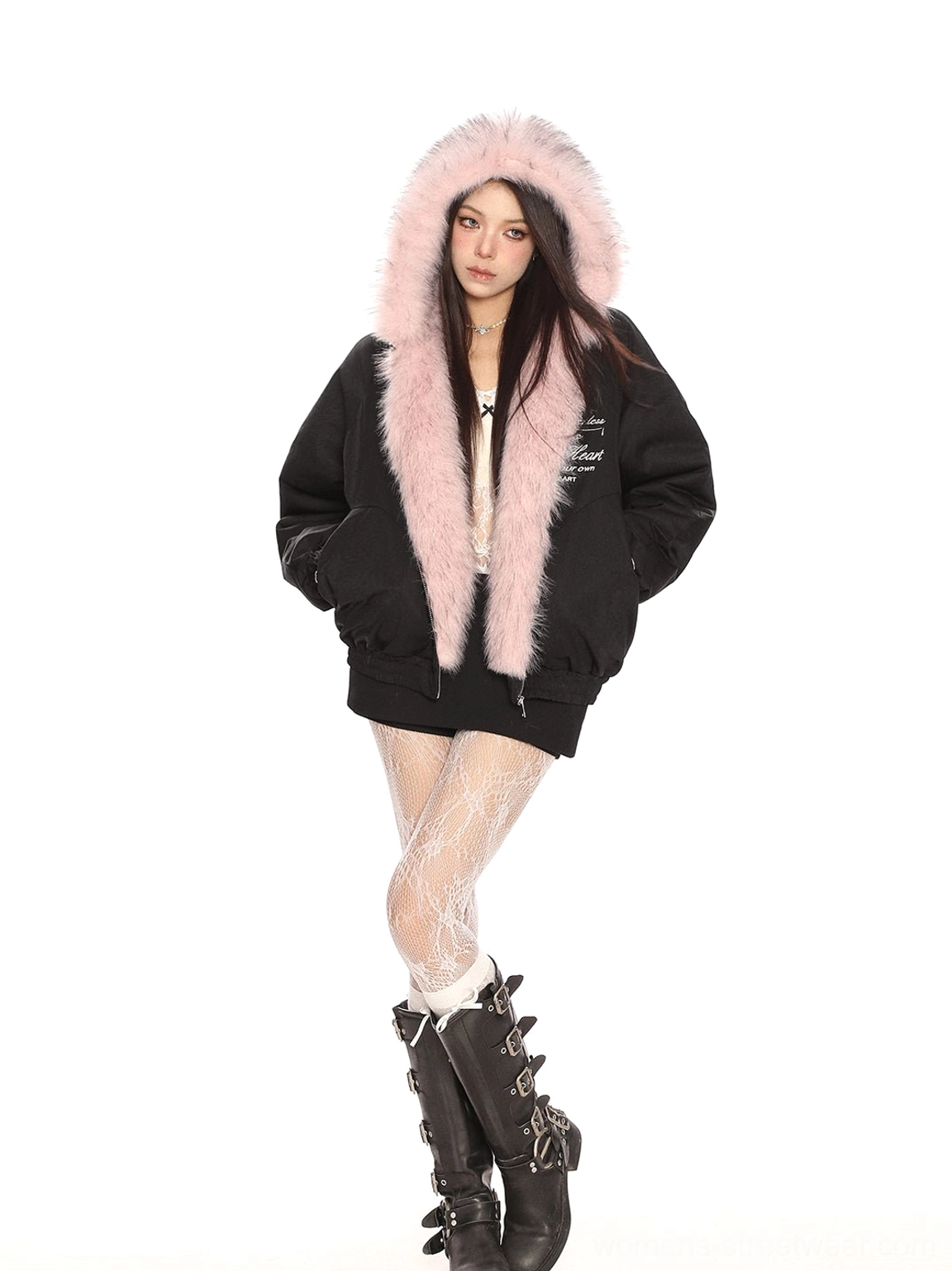 Oversized black pink faux fur trimmed puffer jacket paired with patterned tights and combat boots