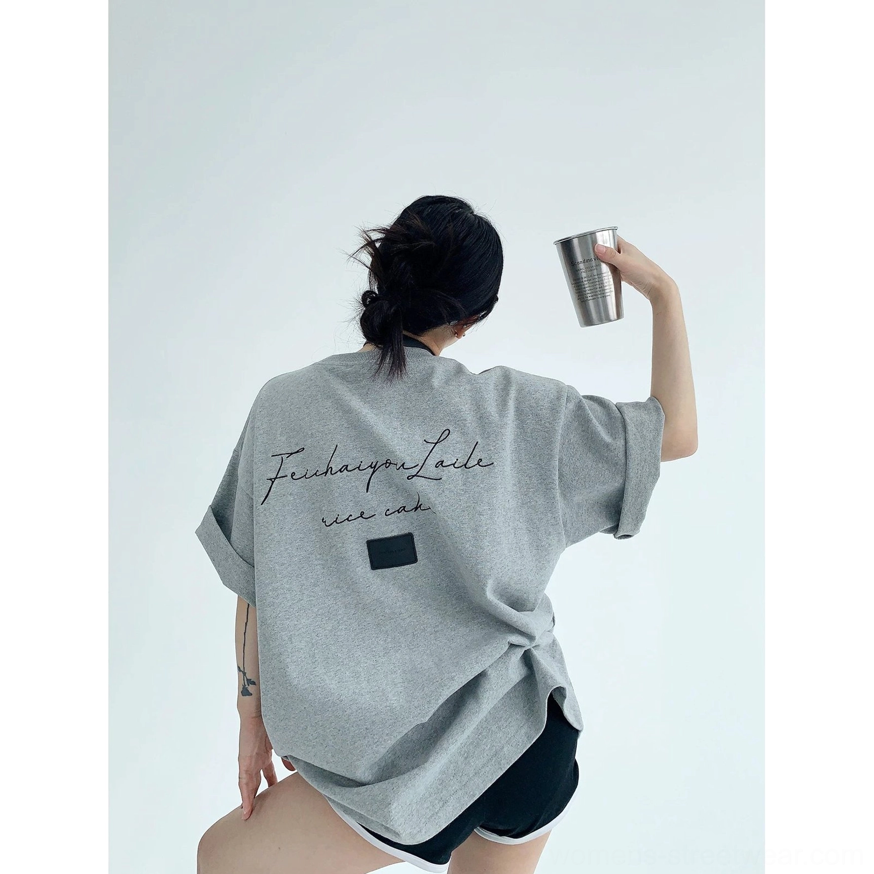 Oversized script backdrop streetwear T-shirt product image with casual cotton construction, drop shoulders, wide sleeves, and relaxed fit
