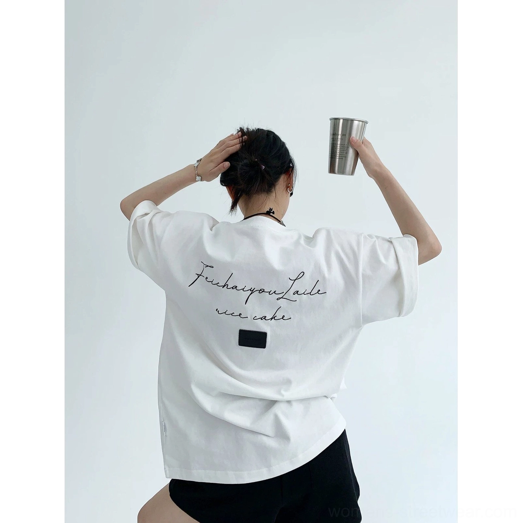 Korean oversized cotton streetwear tee product image featuring minimalist front lettering, loose silhouette, and everyday styling potential