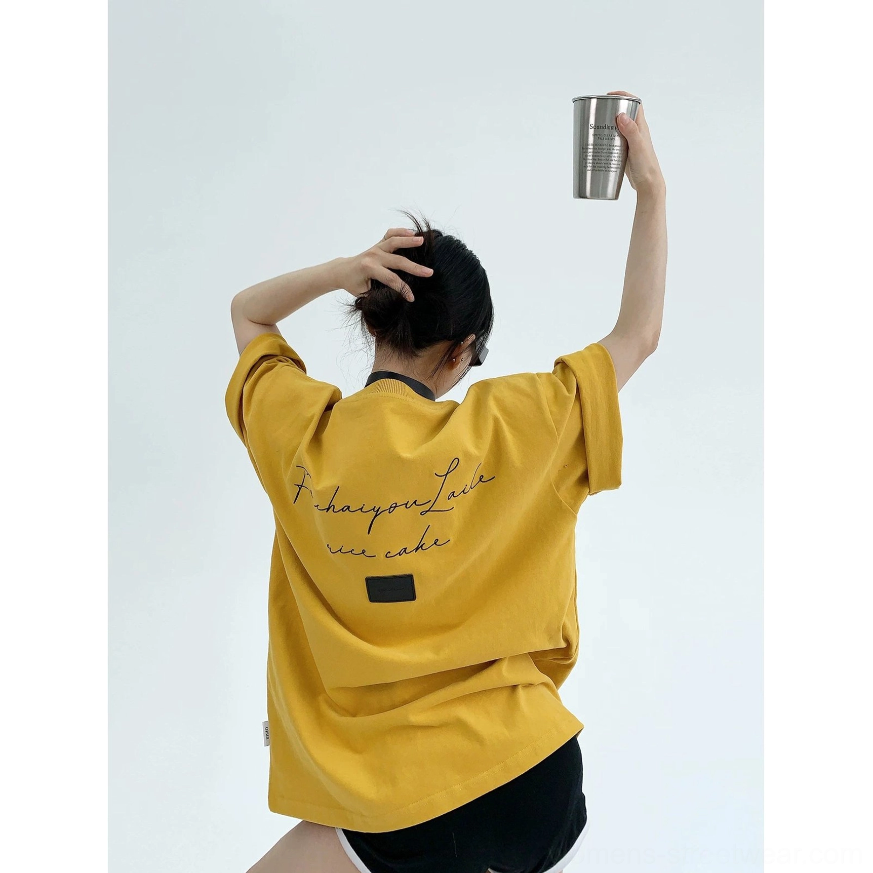 Oversized script back cotton T-shirt product image highlighting cursive streetwear lettering, square patch, relaxed sleeves, and boxy silhouette