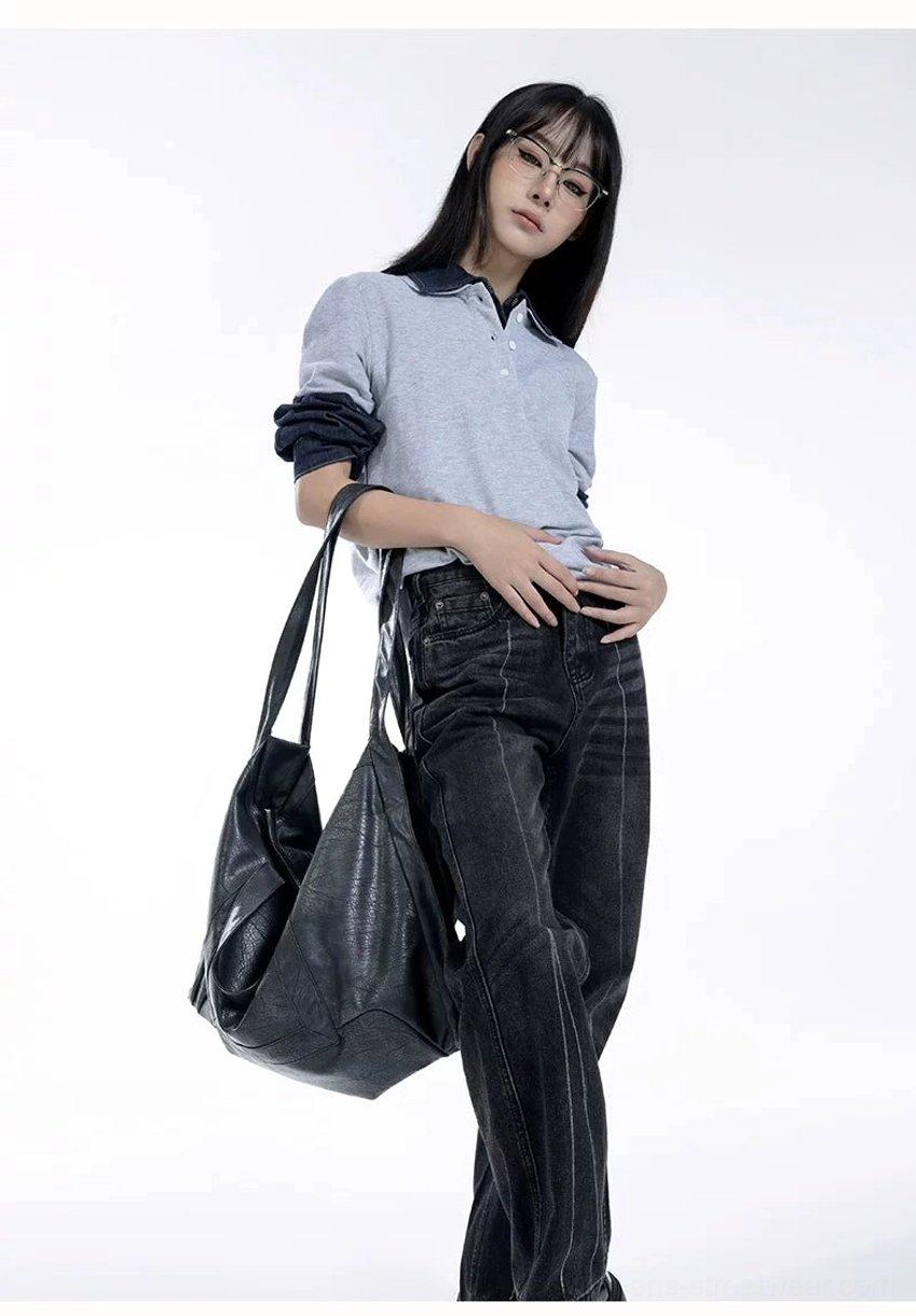 Oversized Shadow Drape slouchy PU leather tote carried on shoulder in relaxed dark streetwear outfit