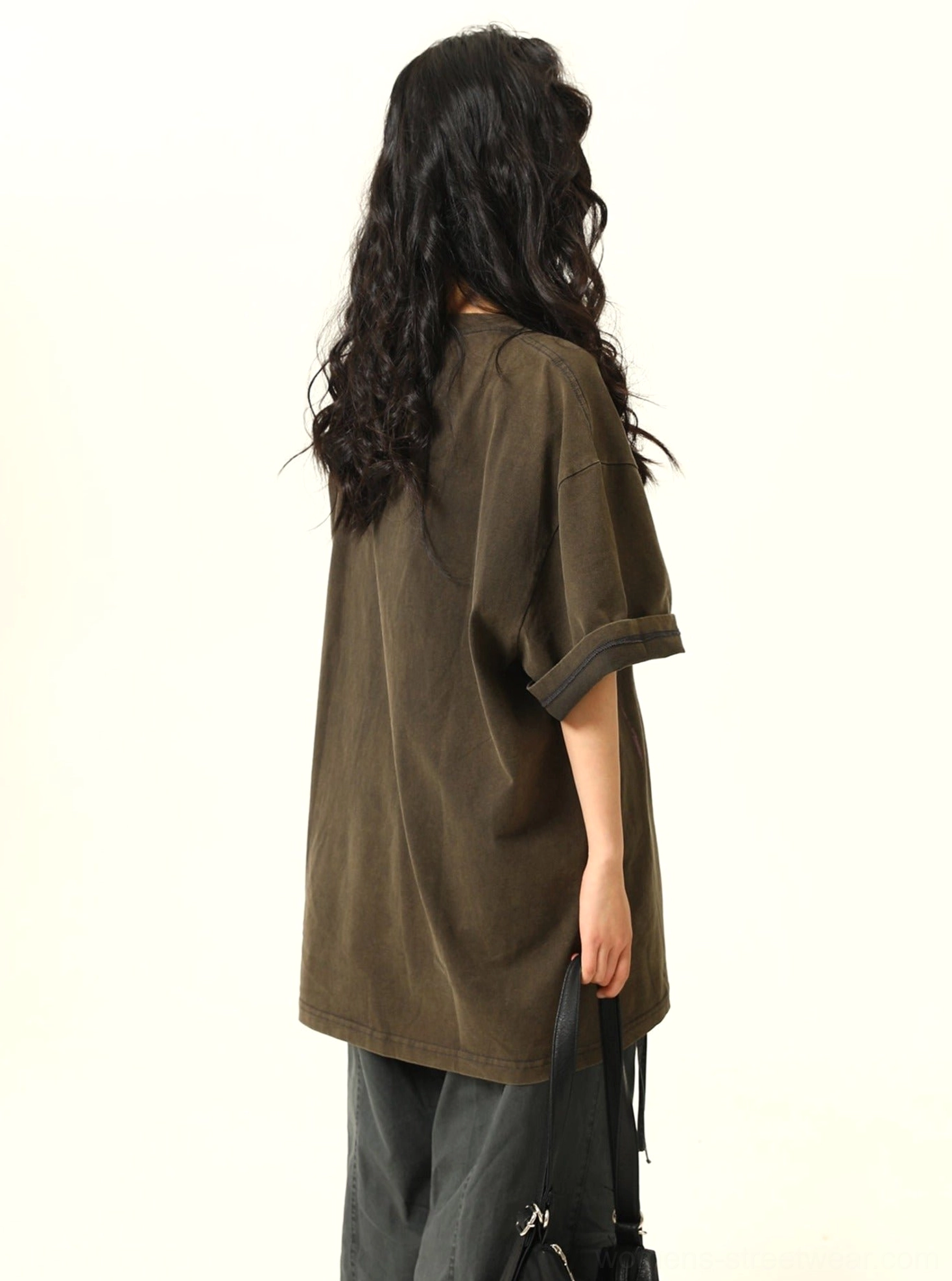 Streetwear shadow print graphic tee with oversized fit and eye-catching hand design suitable for everyday city styling