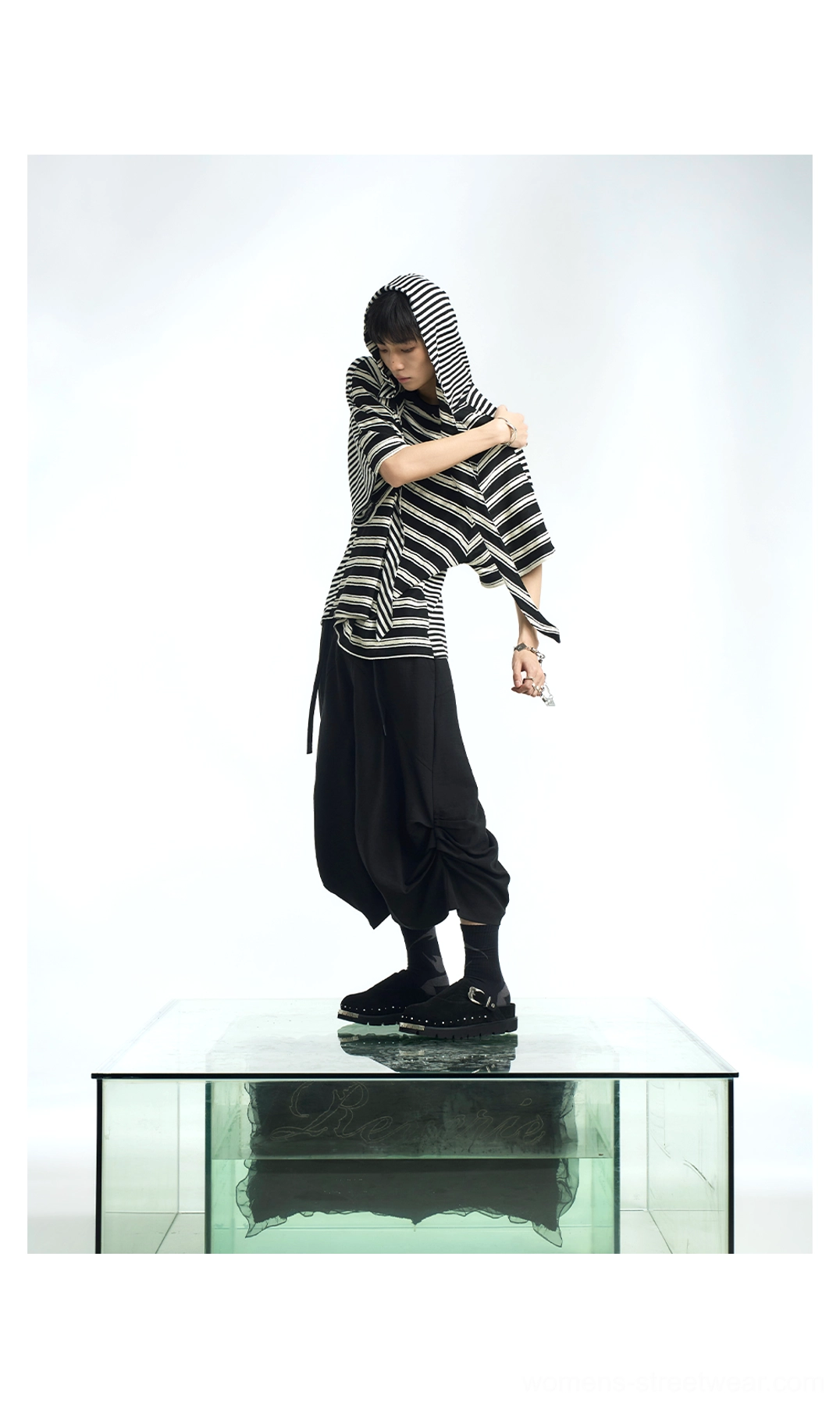 Black and white striped hooded scarf oversized T-shirt showing sculptural layered neckline