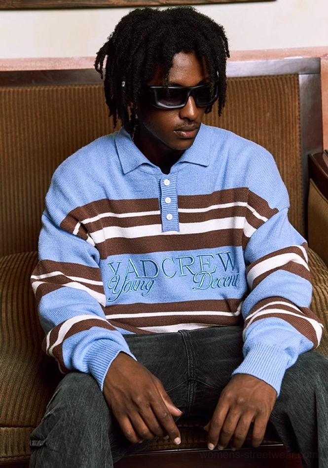 Oversized striped polo knit sweater close view showing blue knit collar and button placket