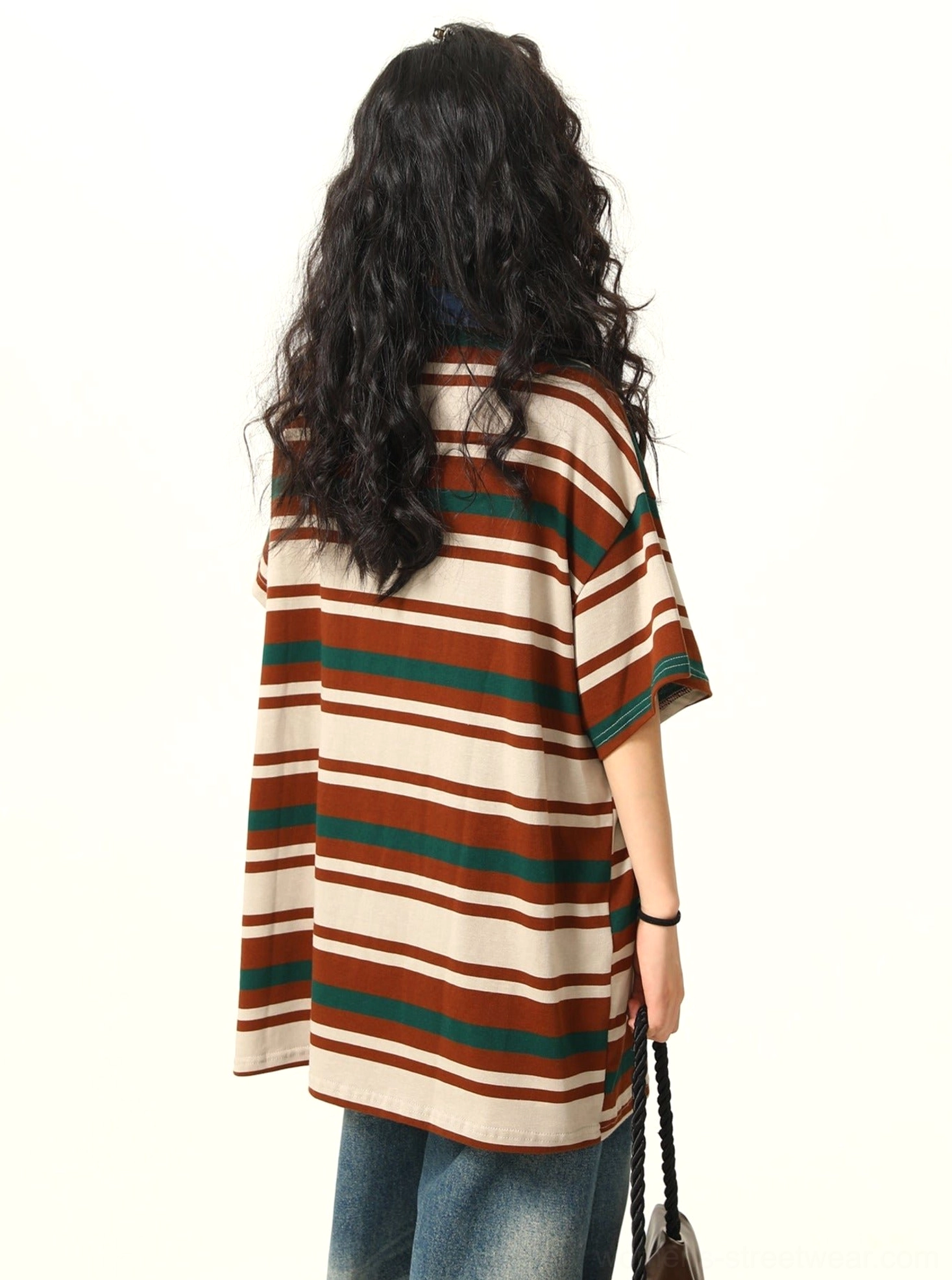 Back view of oversized brown green beige horizontal striped polo shirt with contrast denim collar
