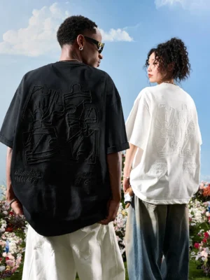 Oversized tonal puzzle embroidery streetwear t-shirts in black and off white worn by two models from the back
