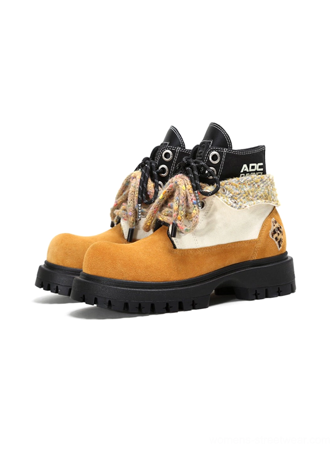 Pair of oversized two-tone suede-look work boots with contrast panels, fuzzy laces and deep black lug outsole