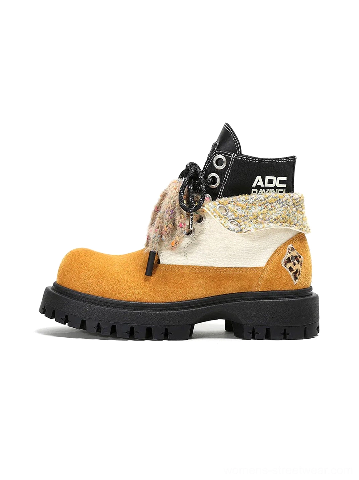 Oversized two-tone suede-look work boots with yellow panels, white side panel, fuzzy laces and chunky black lug sole side view
