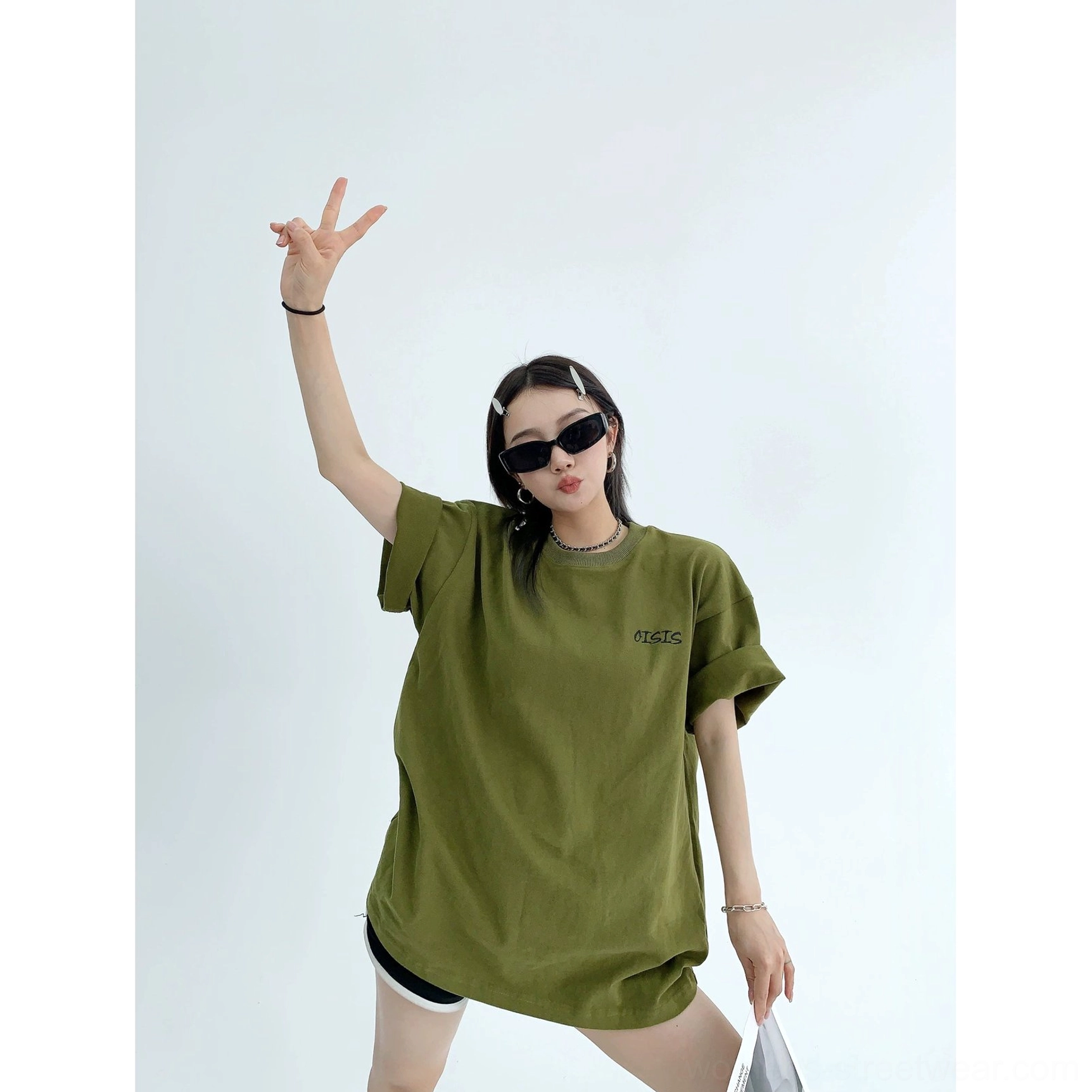 Army green oversized cotton streetwear T-shirt front detail with crew neck rolled cuffs and embroidered chest accent