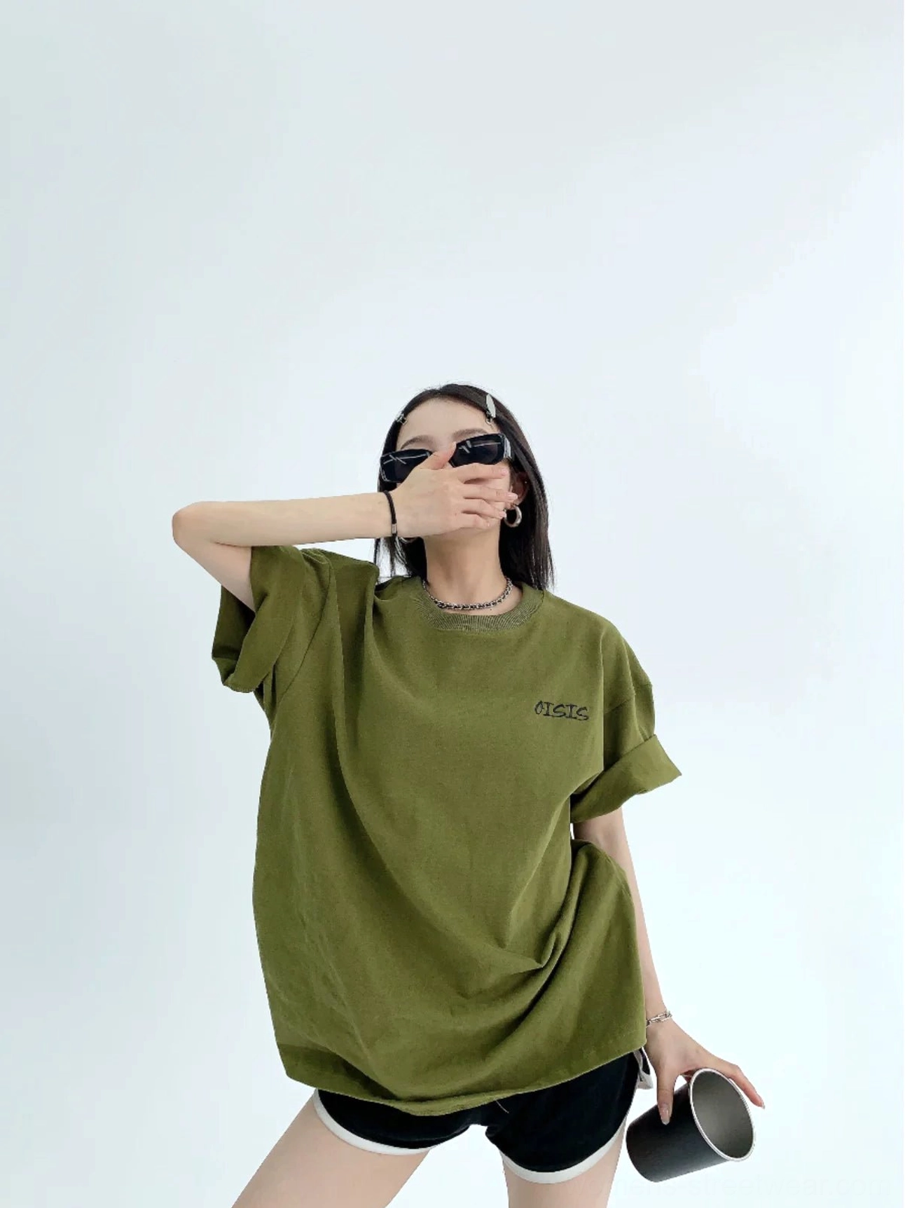 Army green oversized streetwear cotton T-shirt with rolled sleeves and small embroidered chest detail front view