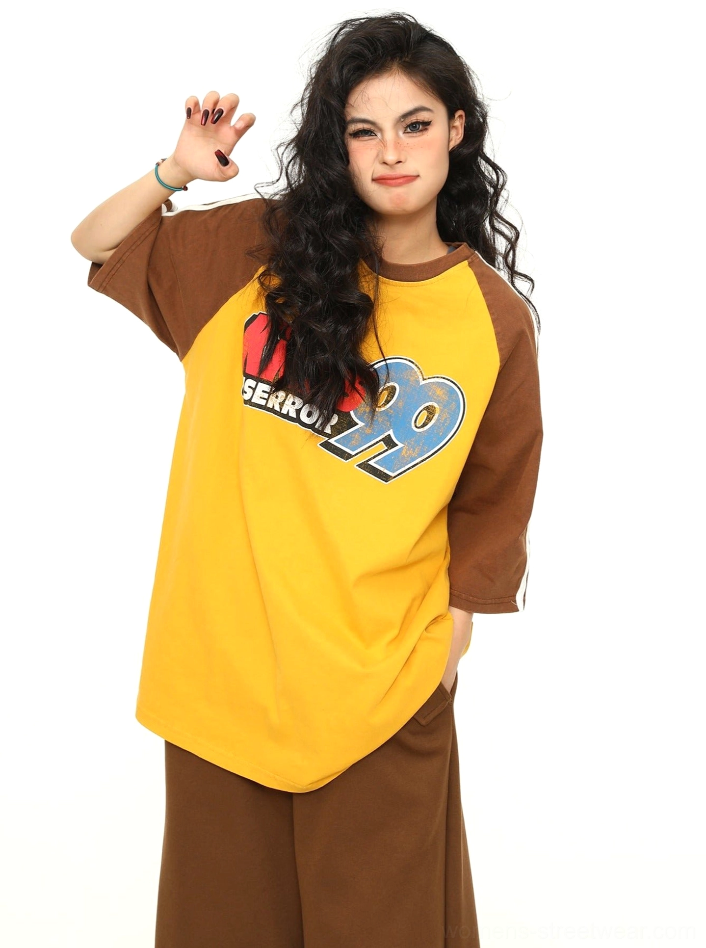 Oversized varsity baseball graphic T-shirt product image featuring a relaxed raglan streetwear silhouette