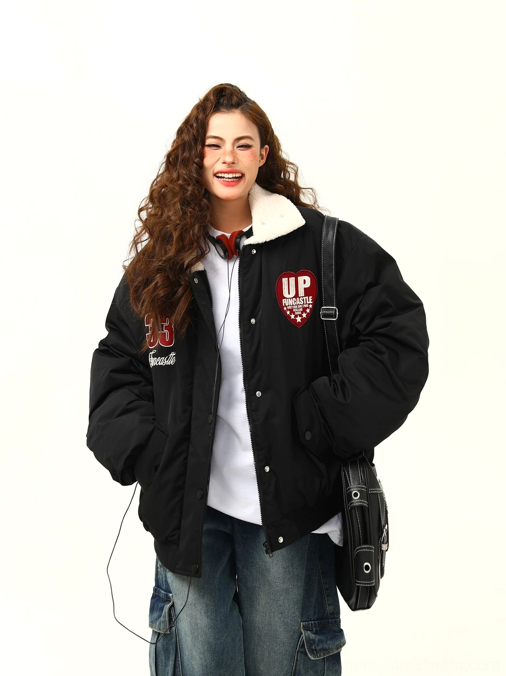 Black oversized varsity patch bomber jacket with soft fleece collar styled with cargo jeans