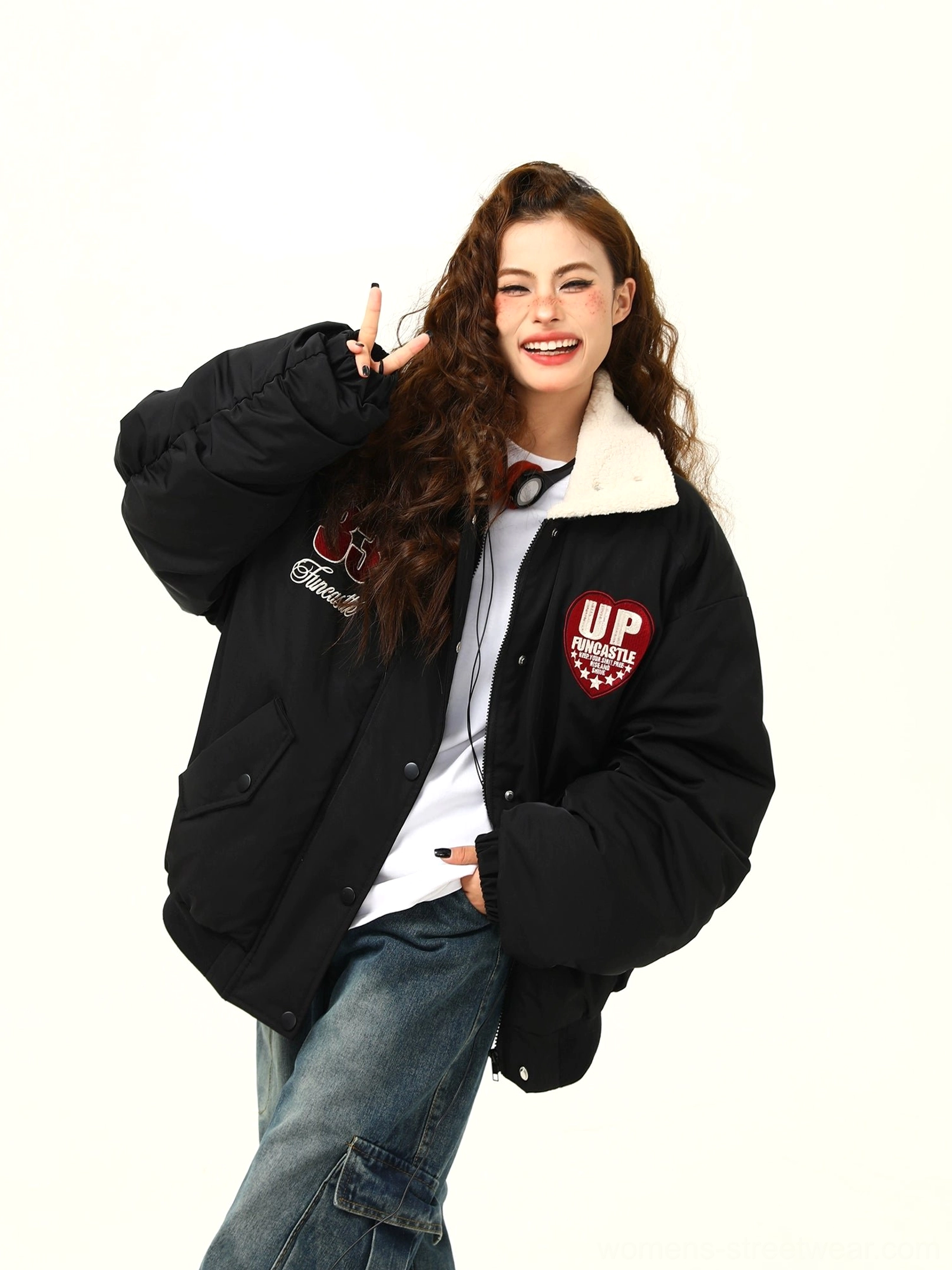 Oversized varsity patch bomber jacket with embroidered collegiate design and snap-button closure