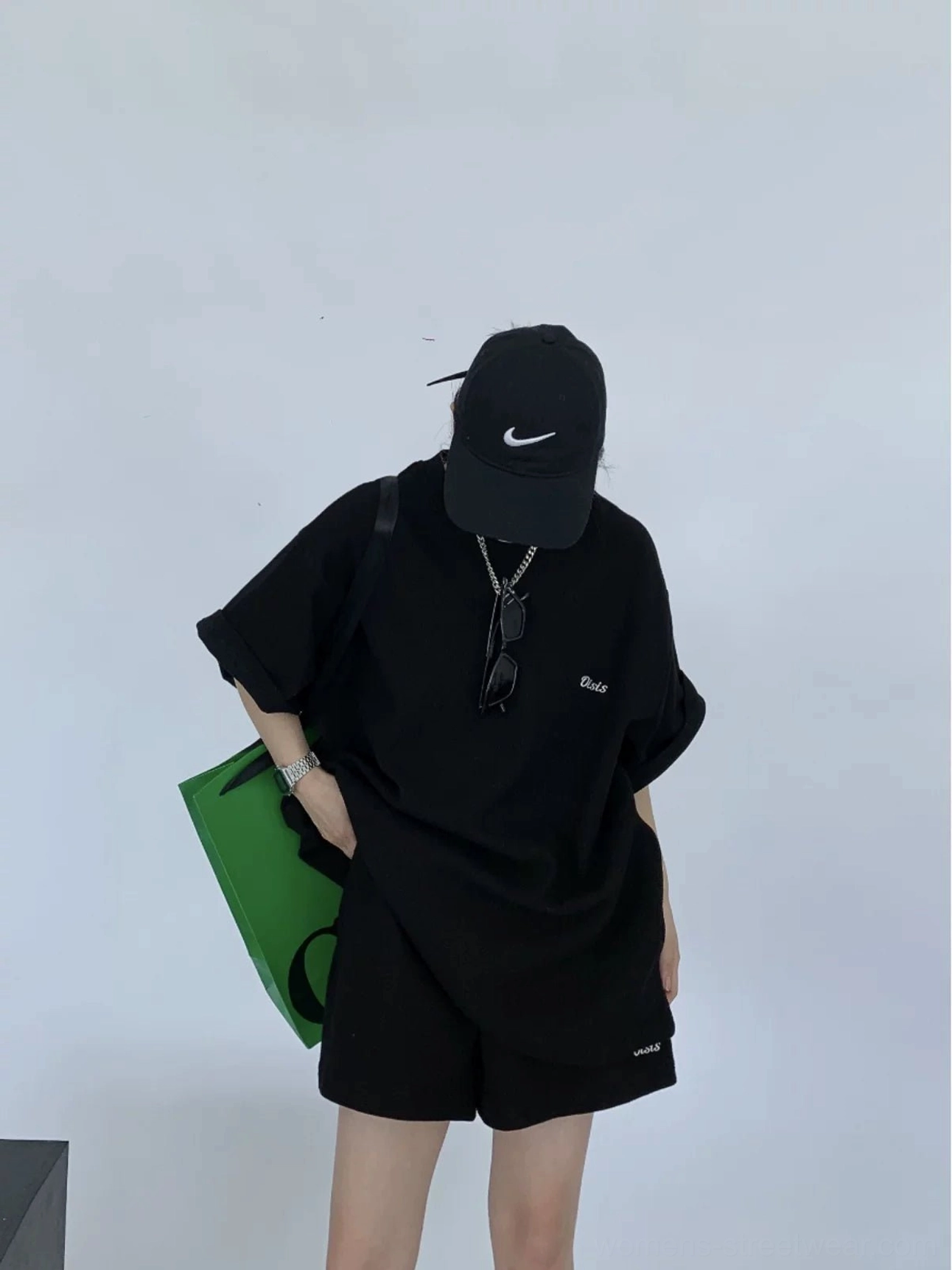Black textured knit oversized T-shirt and shorts matching streetwear set back three-quarter view
