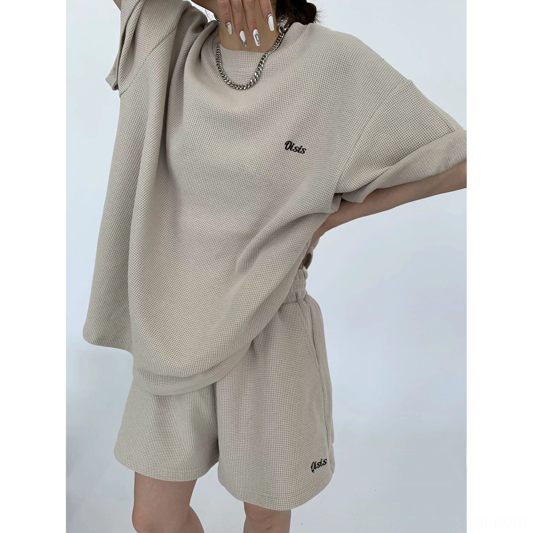 Close-up of sand waffle knit cotton T-shirt and shorts set with subtle embroidered details