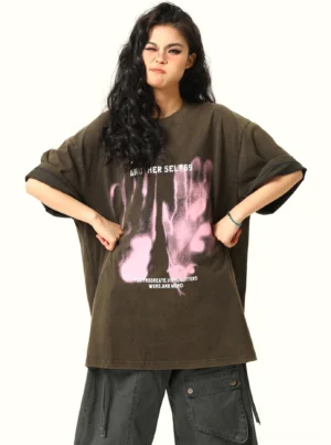 Black oversized washed handprint grunge graphic T-shirt front view styled with dark gray cargo pants