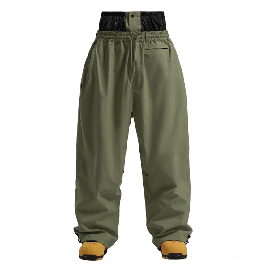 Army green baggy waterproof snow pants with wide leg snowboard silhouette and adjustable hems