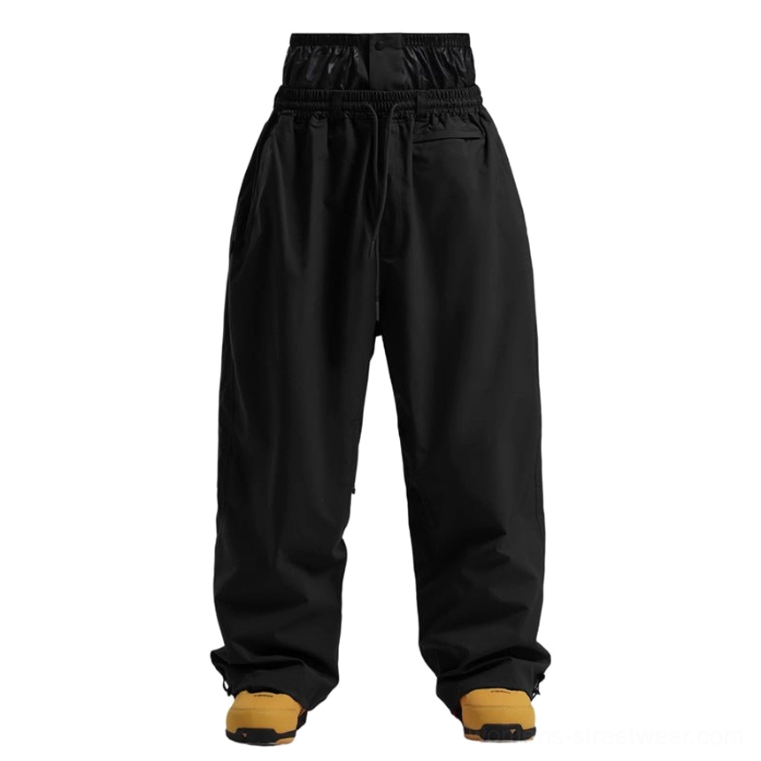 Black oversized streetwear snow pants with matte waterproof fabric and drawstring waistband