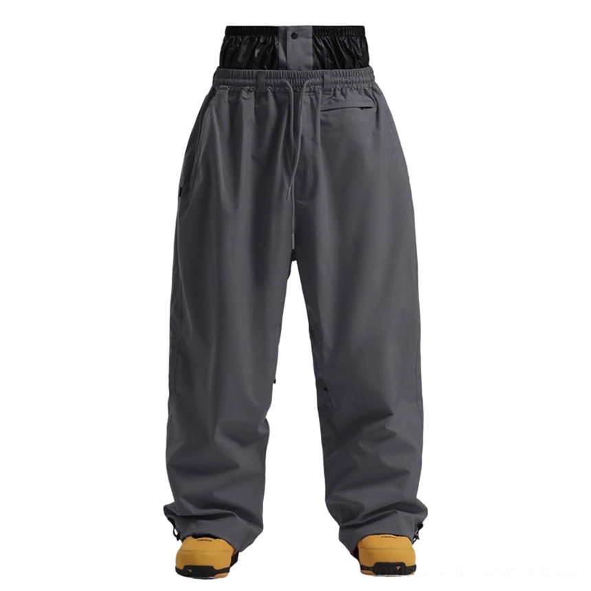 Dark grey oversized snowboarding pants with double layer waistband and adjustable ankle cuffs