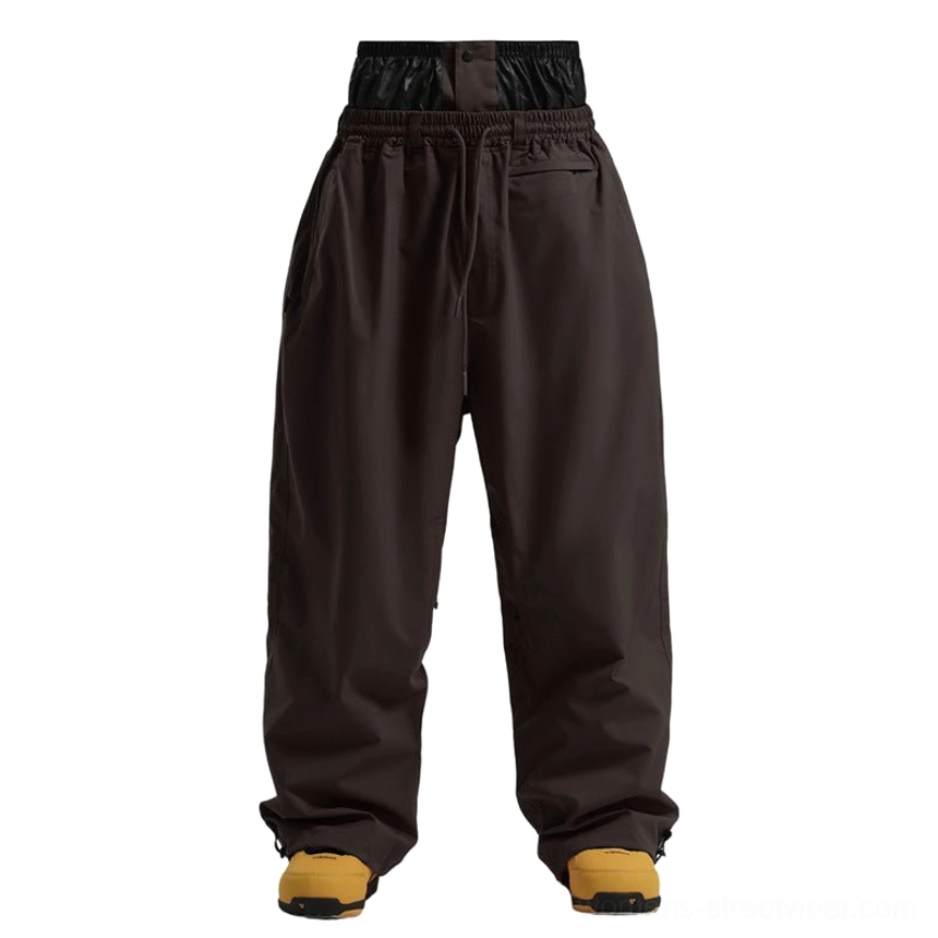 Baggy waterproof snowboarding pants featuring adjustable drawstring waist and functional winter design