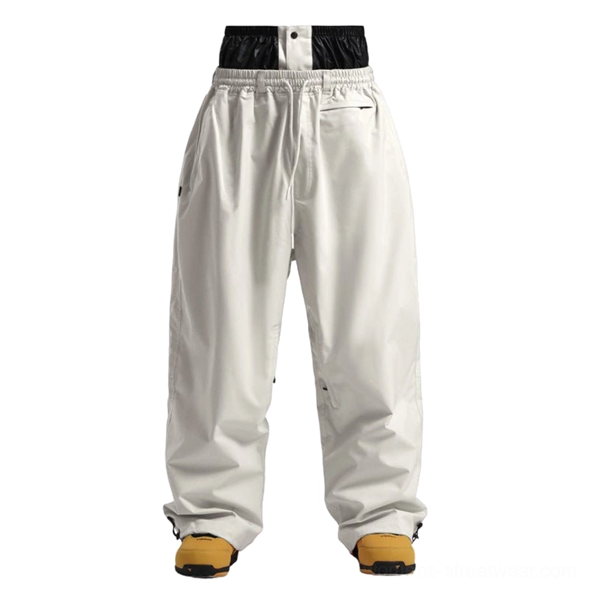 Oversized waterproof streetwear snow pants with insulated lining and relaxed wide leg construction