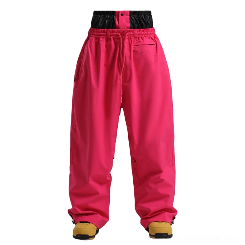 Rose red oversized waterproof snow pants with baggy wide leg silhouette for streetwear snowboarding