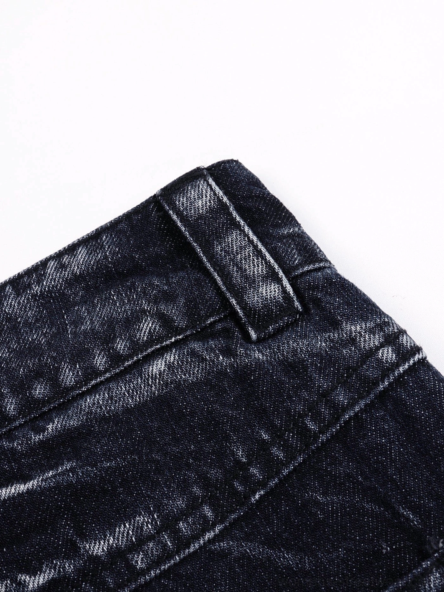 Oversized Y2K streetwear denim jeans with dark indigo wash and graphic lightning-style bleaching