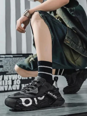 OWL 3.0 black chunky platform dad sneakers worn with striped crew socks and denim shorts streetwear outfit