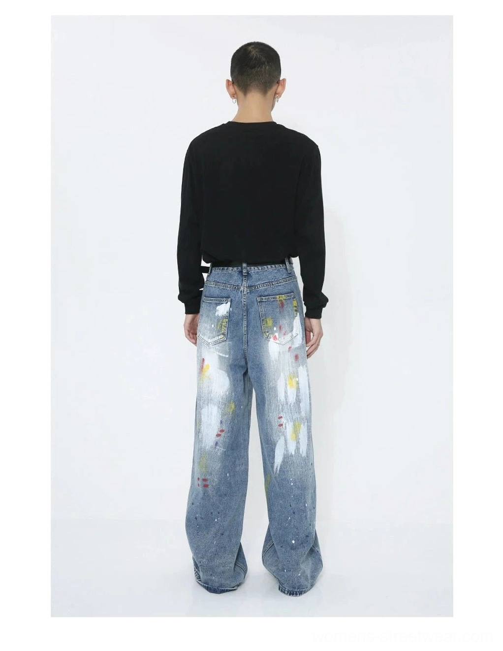 Full rear view of faded blue paint splatter wide-leg jeans with artistic graffiti decoration and detailed back pocket styling