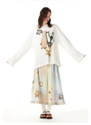 White painterly cat print oversized tunic styled with watercolor floral midi skirt in a full streetwear outfit