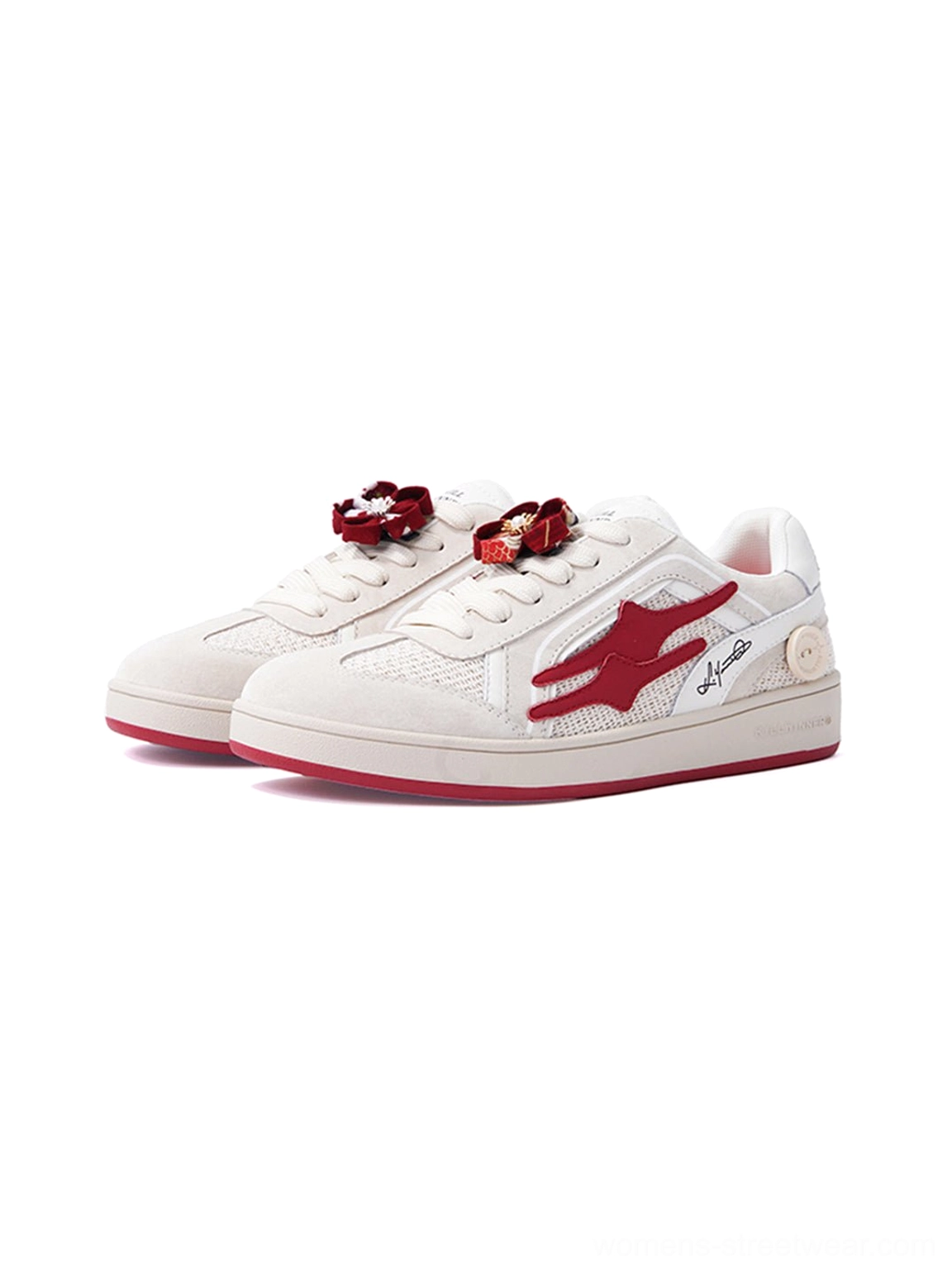 Pair of beige and red retro streetwear sneakers displayed from the front side with mesh panels, red flame logos, and flower lace ornaments