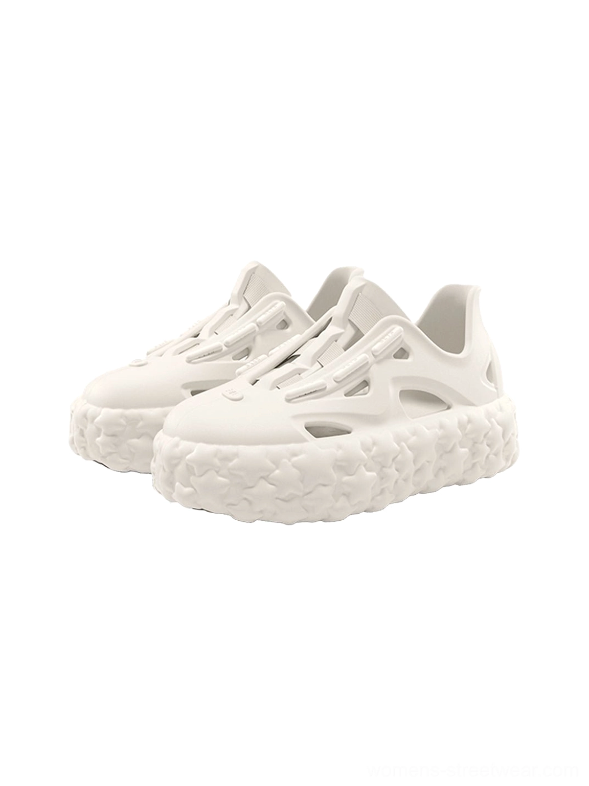 Pair of beige star platform sandals shown from a front three-quarter angle with cutout straps and chunky textured soles