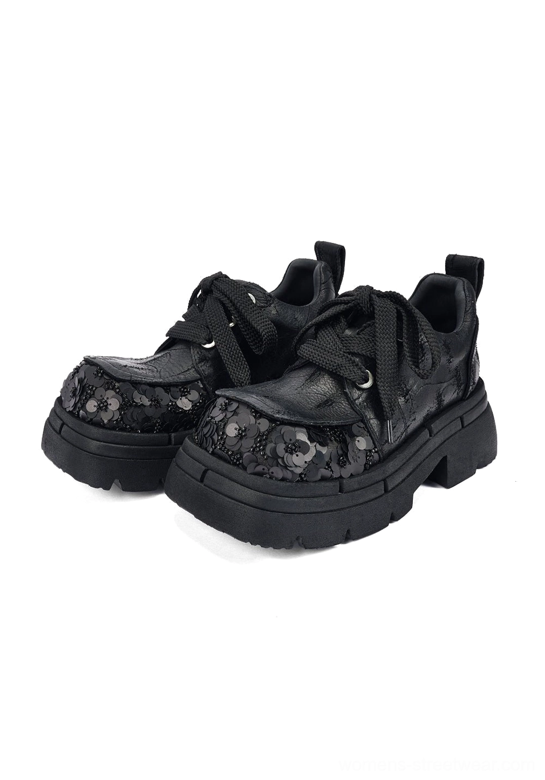 Pair of black floral sequin platform derby shoes in front flat lay, showing embellished toe caps, rope laces, rear pull tabs, and thick soles