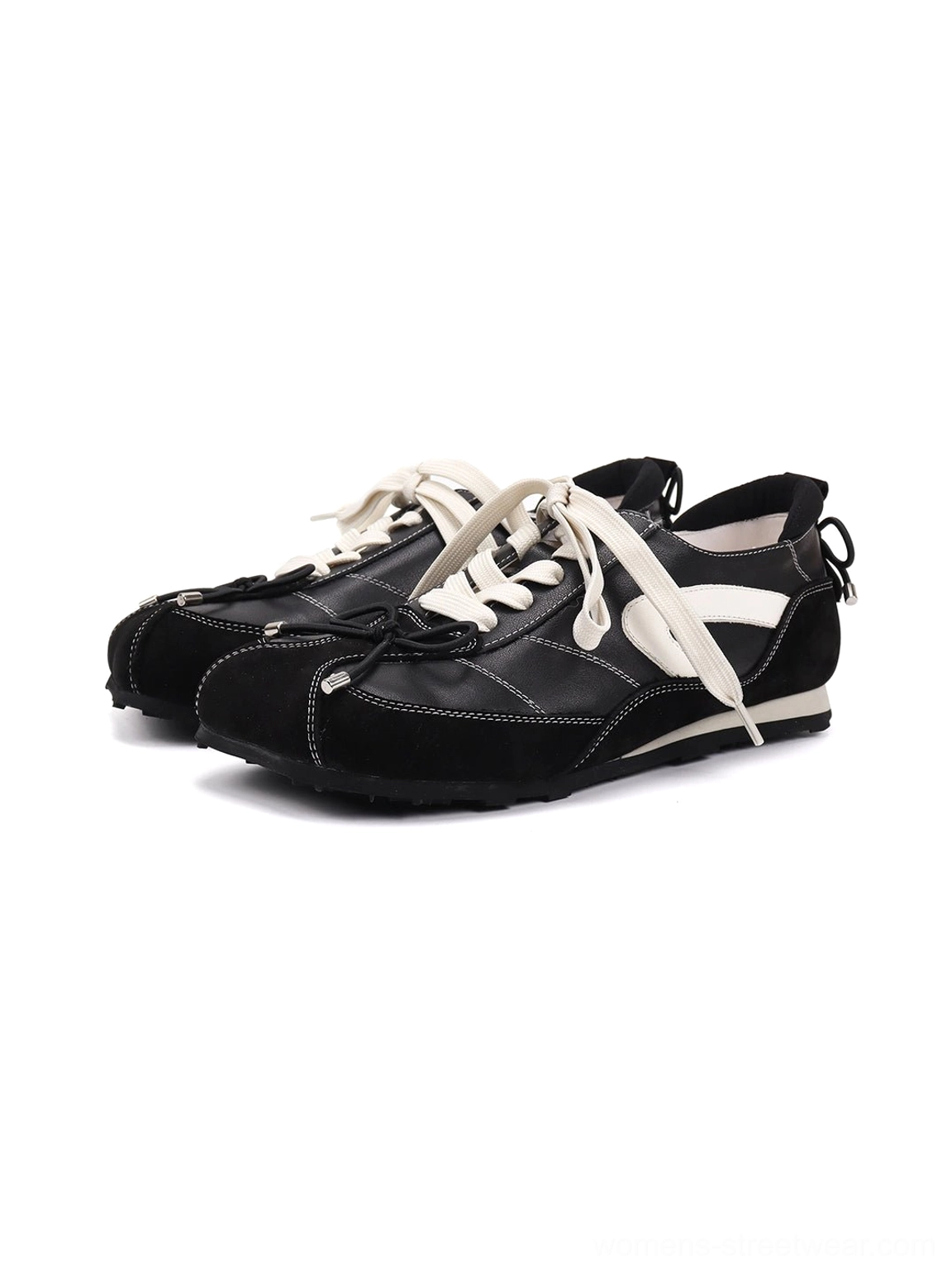 Pair of black leather sport ballet flats showing white side stripes, flat foam-rubber soles, and rear heel pull tabs