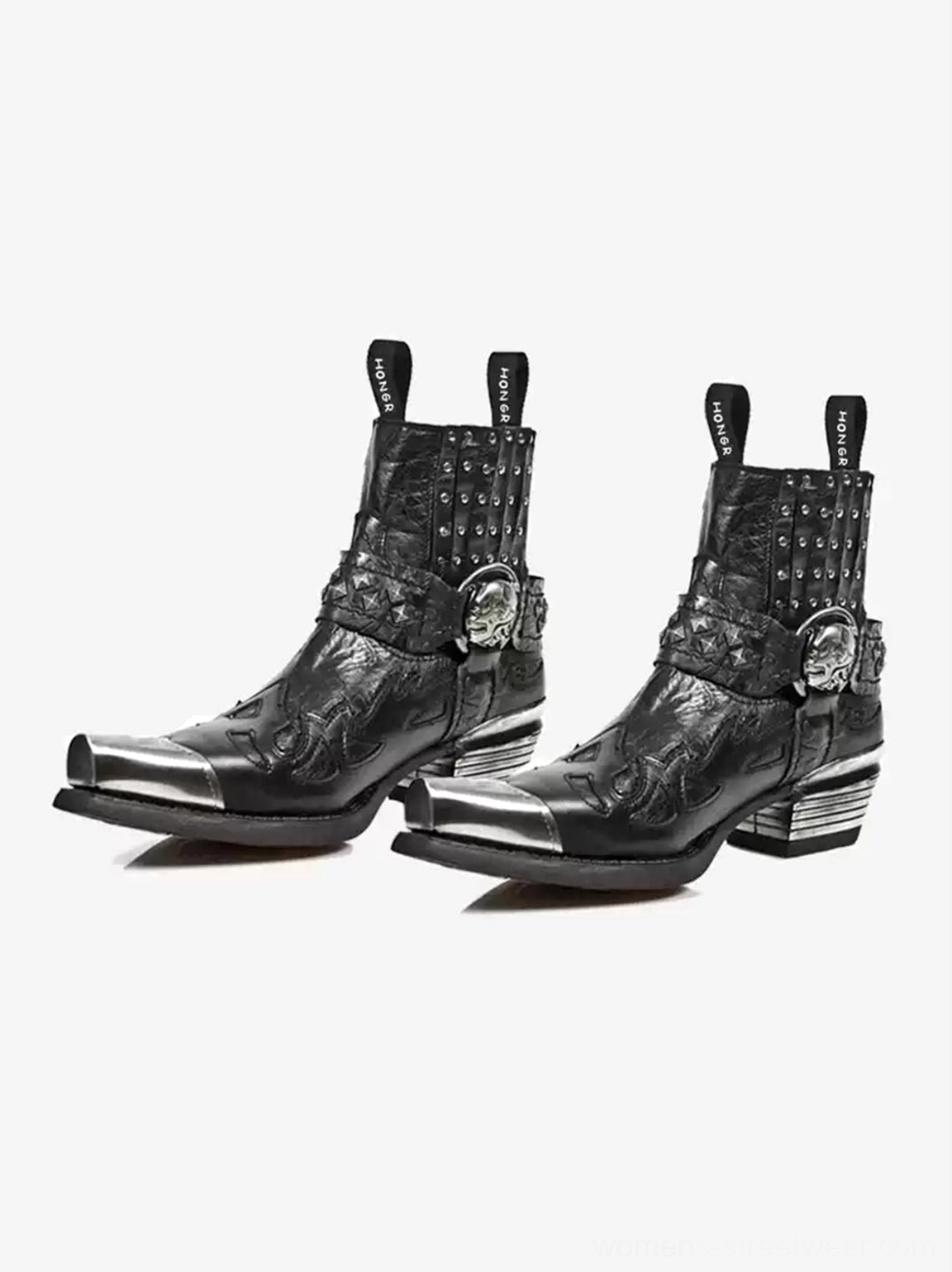 Pair of black pointed-toe Chelsea boots with skull buckle ankle straps studded collars dual pull tabs and layered metal heels