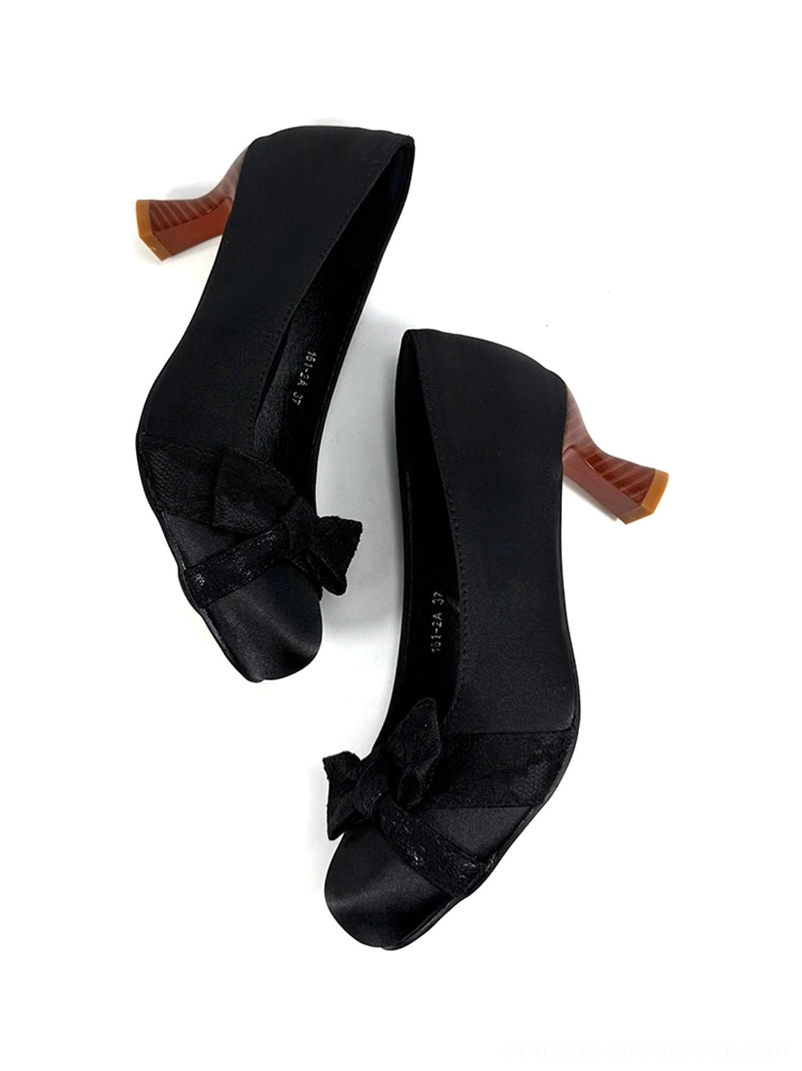 Pair of black satin-look bow pumps viewed from above with leather insoles, matching bows, and sculpted contrast heels
