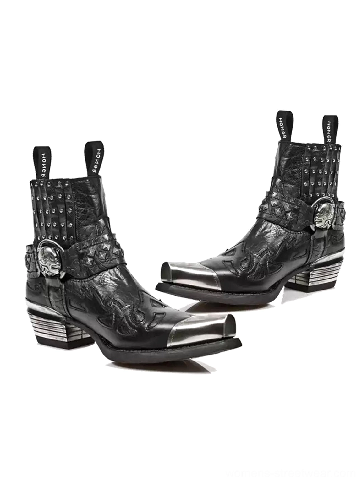 Pair of black studded western Chelsea boots with matching skull buckles silver toe caps and layered metal block heels