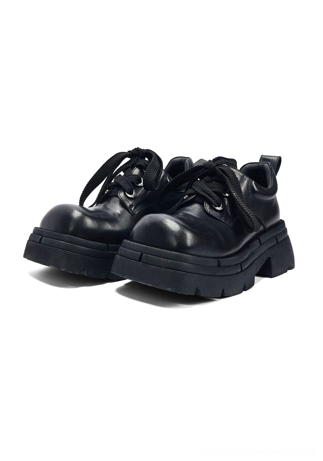Pair of black women's platform derby shoes in a front three-quarter view with polished upper, matching laces, thick lug sole, and rear pull tabs